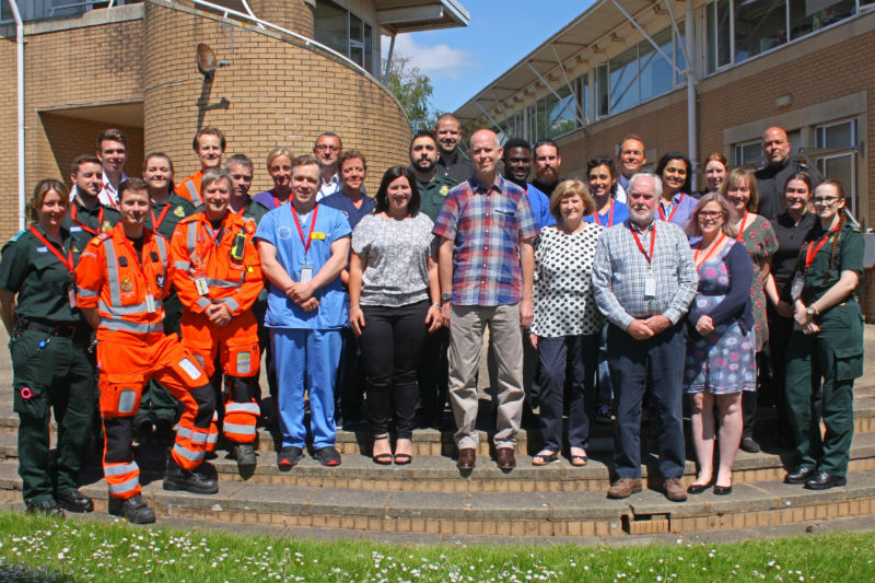 Ben and his family with the officers and NHS staff who saved his life Image copyright SWASFT