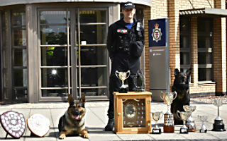 PC Dalrymple with PD Ash left and retired dog Aden right